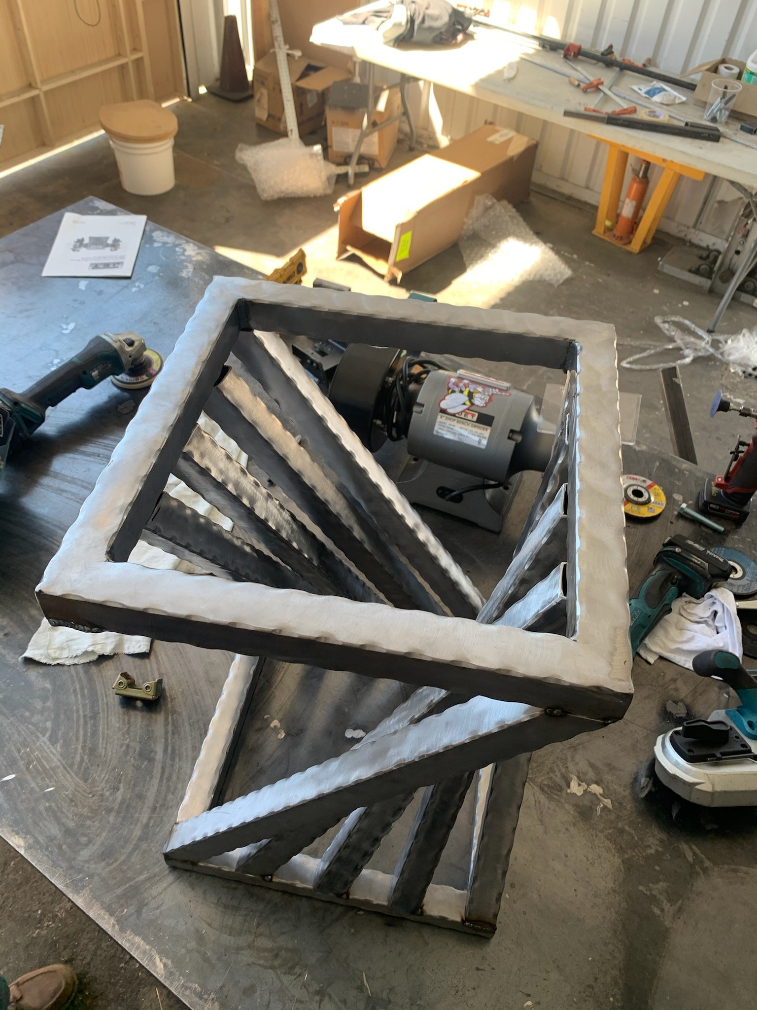 Welded steel frame on a fabrication table in the shop